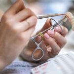 Dental technician working on a prosthetic denture in a dental laboratory