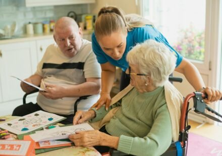 Caregiver assisting older adults in a healthcare setting