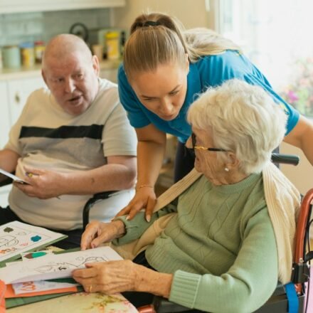 Caregiver assisting older adults in a healthcare setting