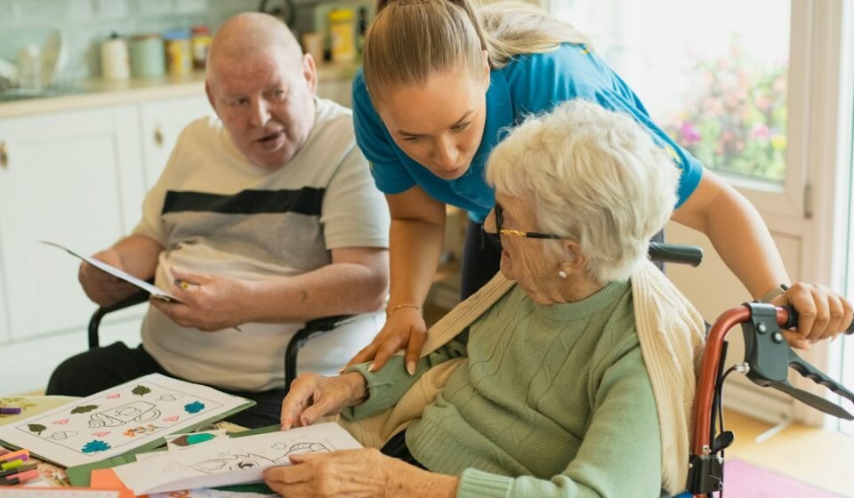 Caregiver assisting older adults in a healthcare setting