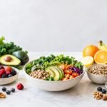 Colorful healthy foods including salad, fruits, vegetables, nuts, and lemon water