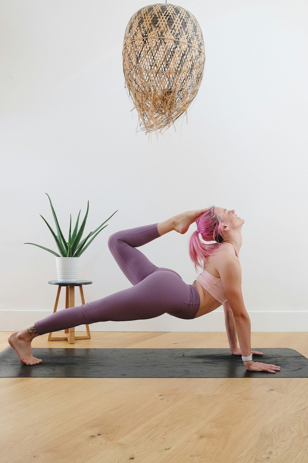 Person demonstrating a modified plank exercise on a mat