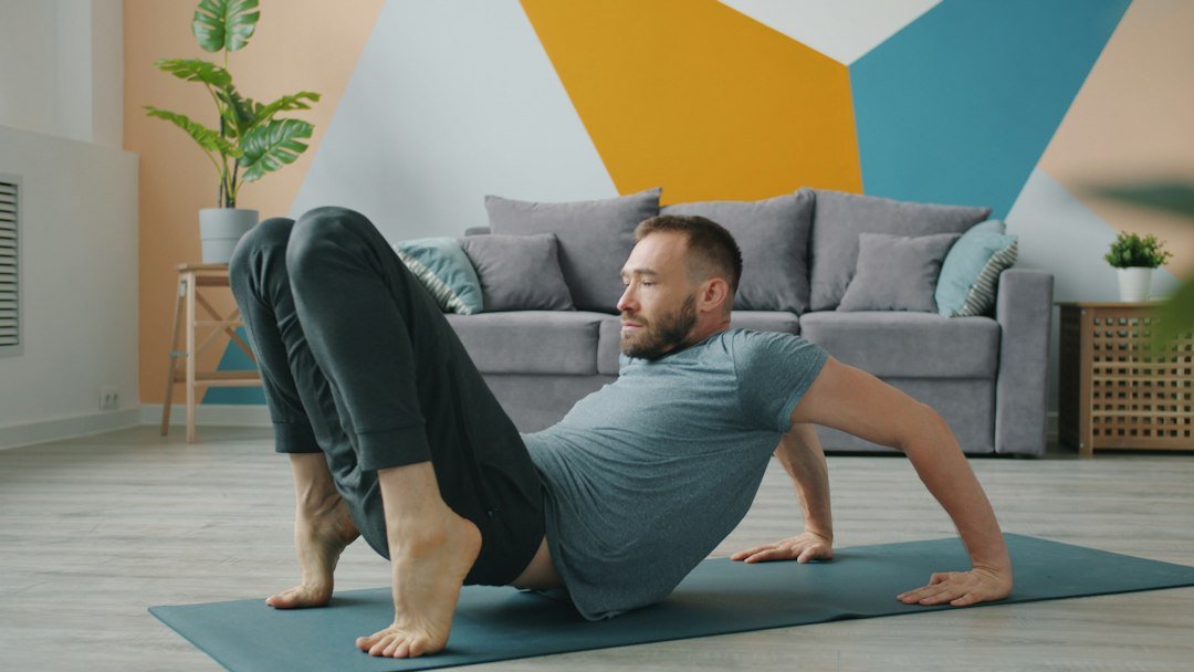 Person performing a floor-based glute bridge style home workout