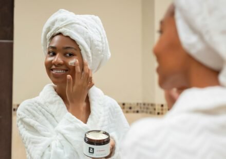 Woman practicing a simple skincare routine with facial cream