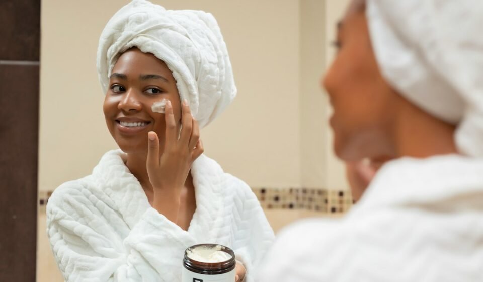 Woman practicing a simple skincare routine with facial cream