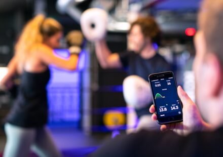 Gym member using technology in a fitness setting