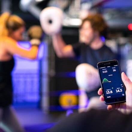 Gym member using technology in a fitness setting