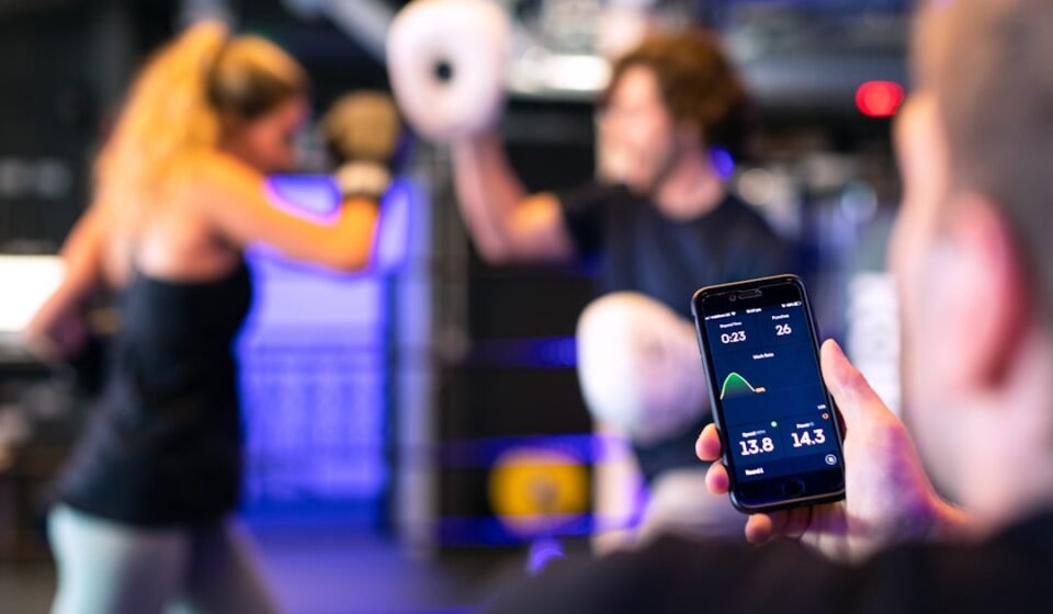Gym member using technology in a fitness setting